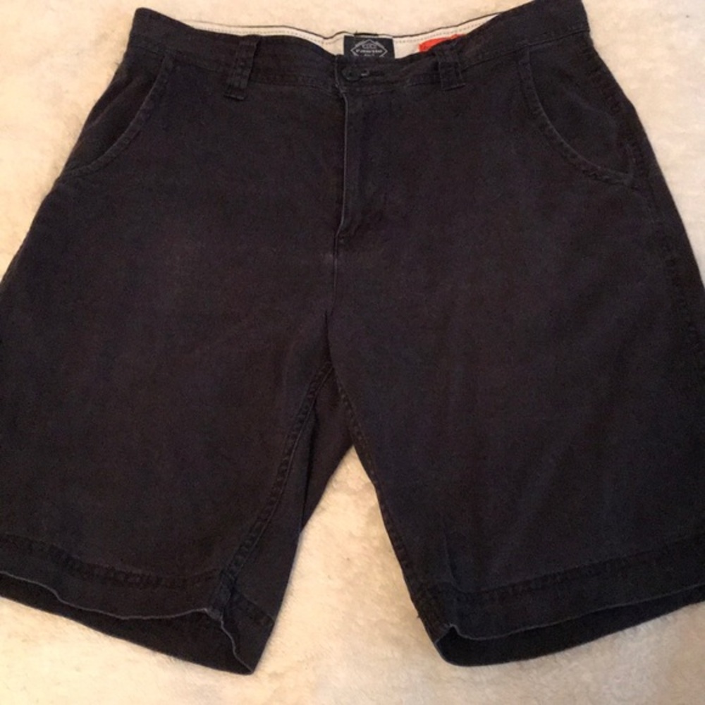 St John’s Bay Flat Front Shorts size 32. Inseam is 9 1/4” and outseam is 21”
